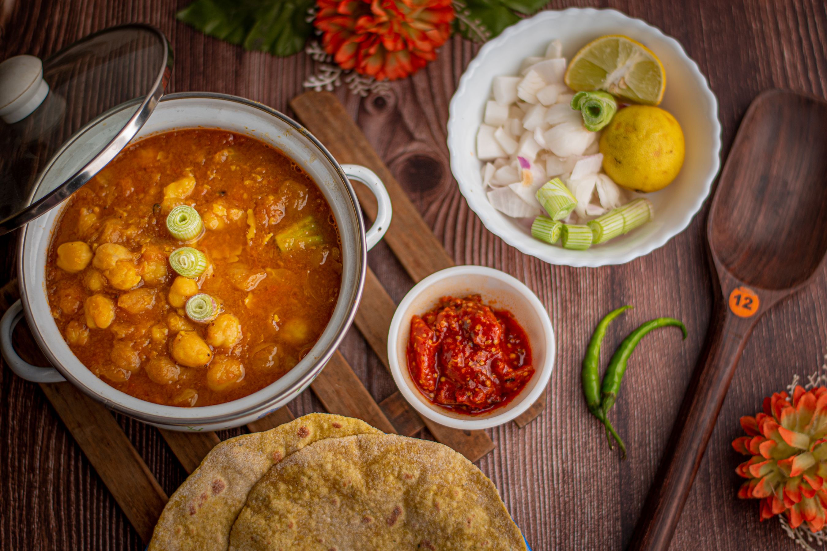 Chole with paneer served alongside fresh bhature