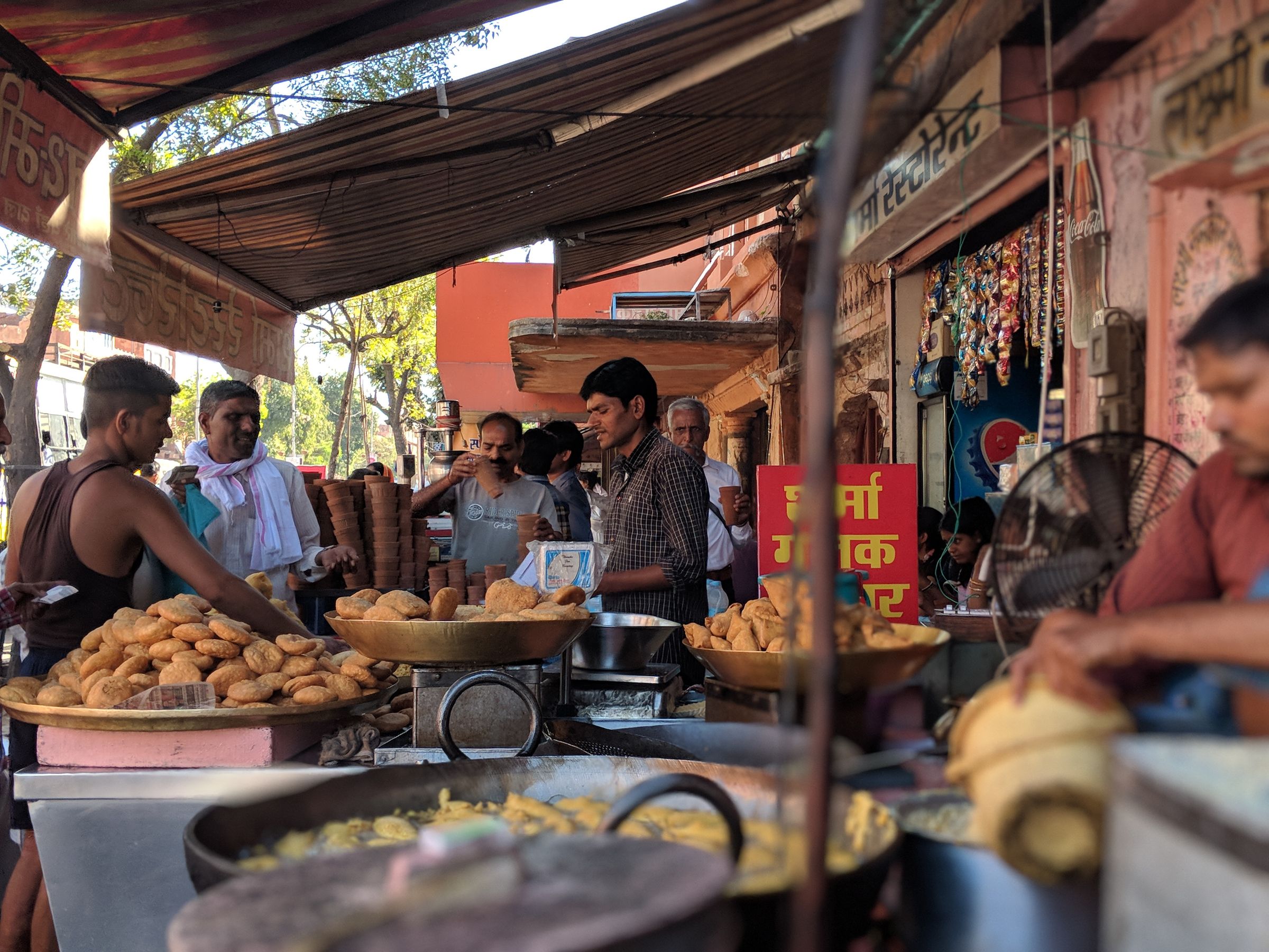 Busy Delhi street food counter frying fresh bhature